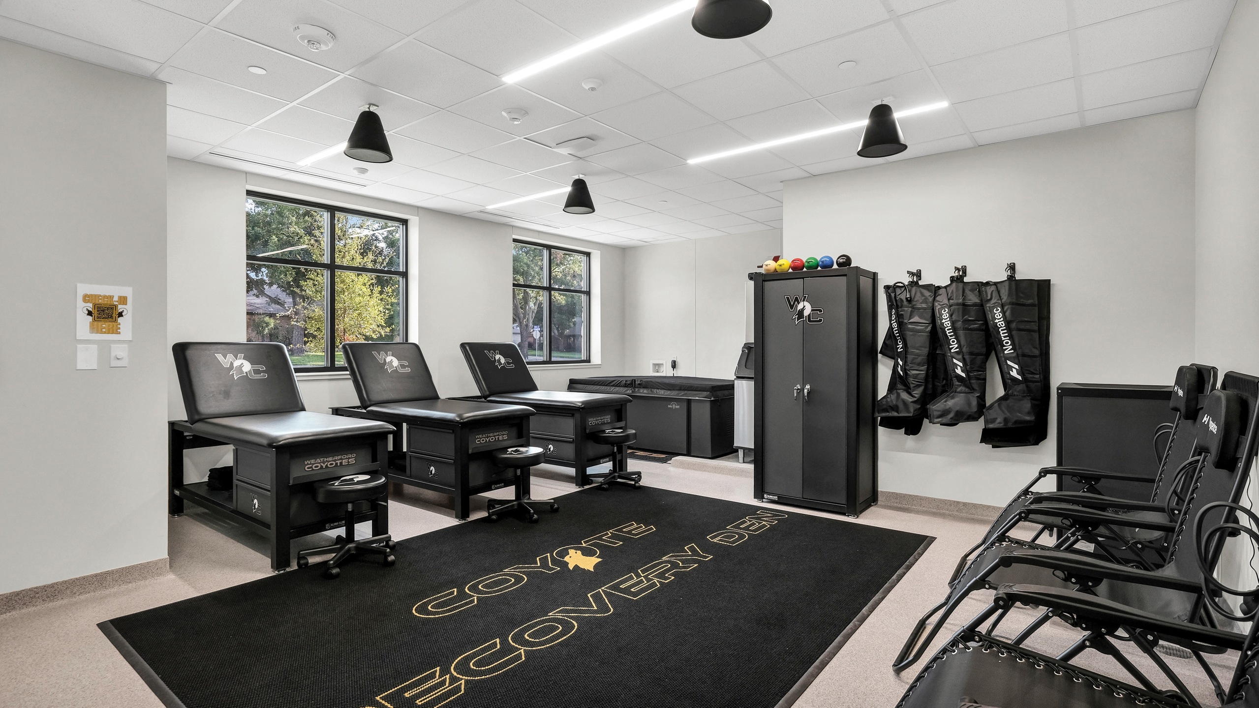 Sports medicine training room with tables and equipment